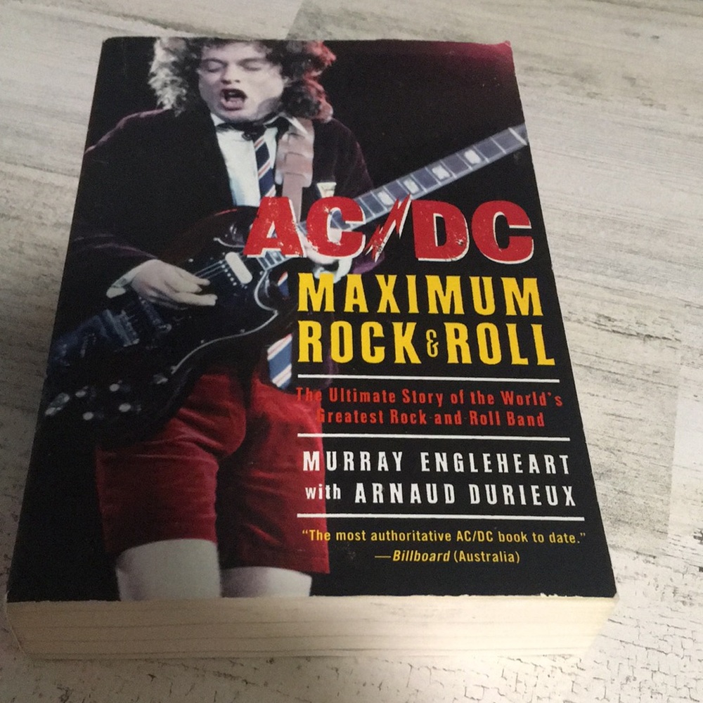 AC/DC Maximum Rock & Roll paperback book.